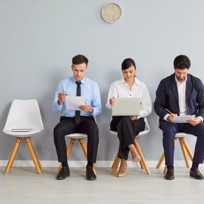 Diverse,Job,Candidates,Sitting,On,Office,Chairs,In,Row,,Business