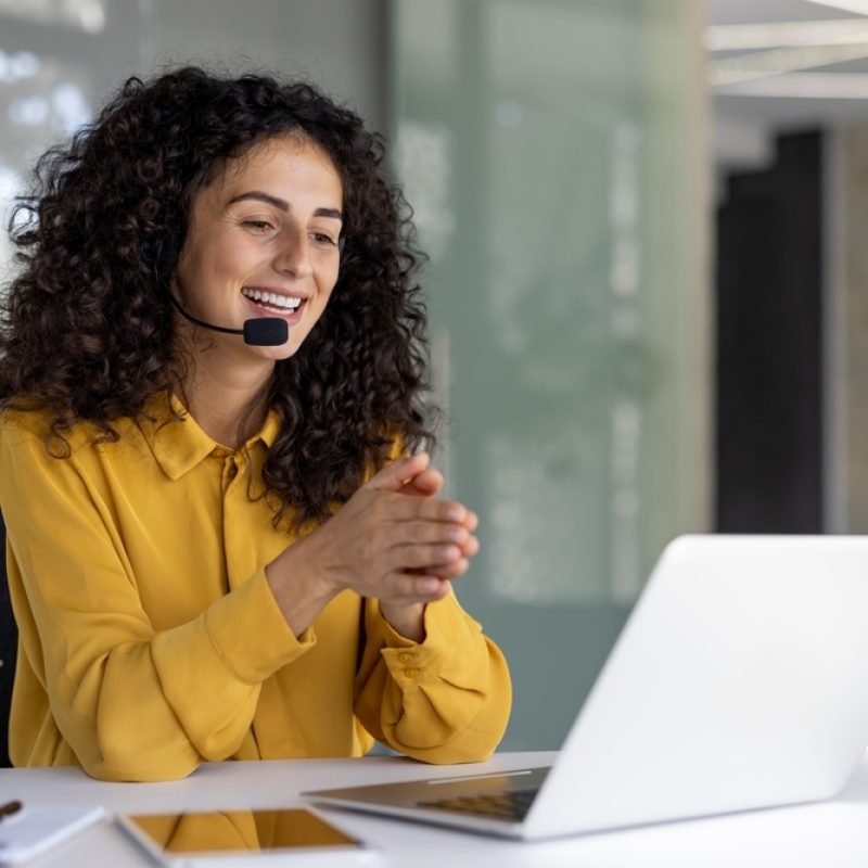 A,Cheerful,Customer,Service,Representative,Wearing,A,Headset,Smiles,While