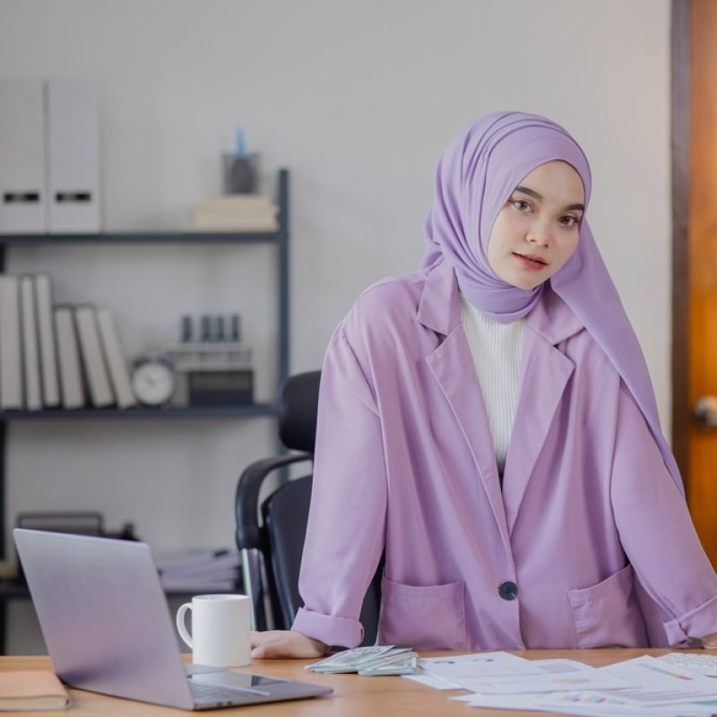 Young,Asian,Islamic,Women,Stressed,From,Work,At,Office,Desk.